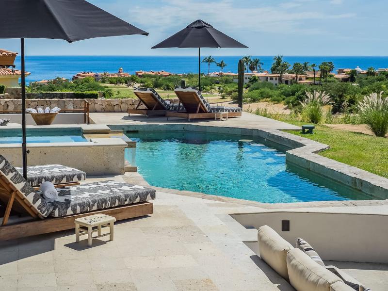 Pool and sun loungers with ocean views at Casa Naah Payil in Cabo del Sol, Cabo San Lucas