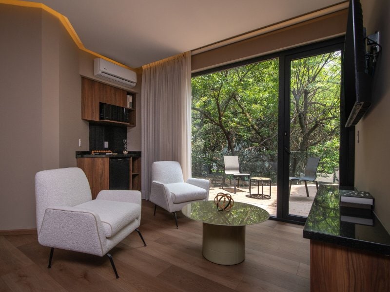 Sitting area opening to the terrace at the Casa Nogal Grand Terrace Suite, a Mexico City Airbnb in Polanco