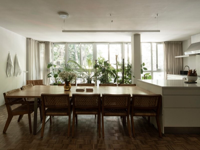 Long dining table and open kitchen at Casa TEO by chef Enrique Olvera, a Mexico City Airbnb in Polanco