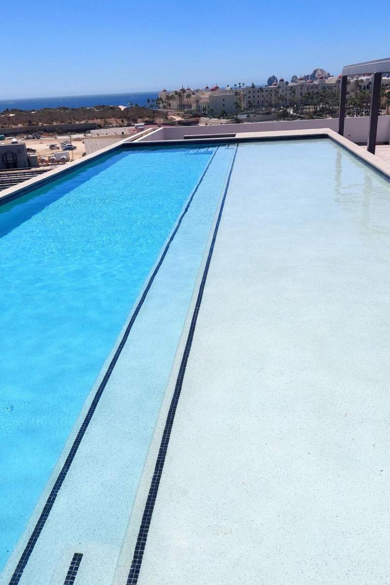 Rooftop lap pool with ocean views at Condo Azul, a brand-new Cabo Airbnb near Médano Beach in El Tezal