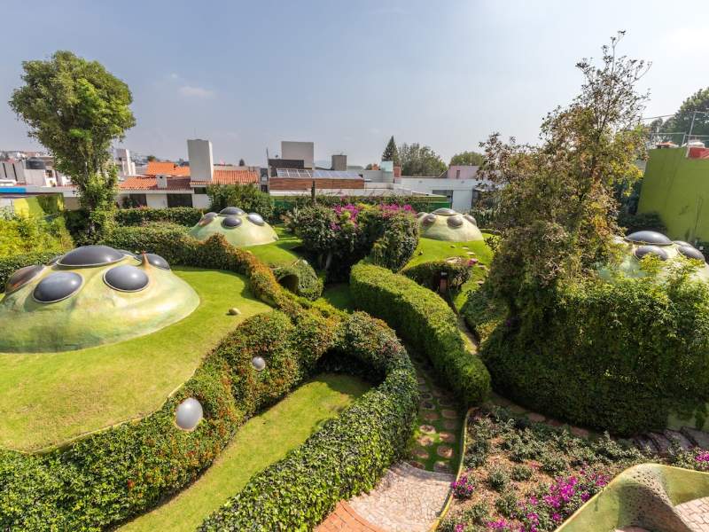 Aerial view of the grass-roofed domes of Conjunto Satélite