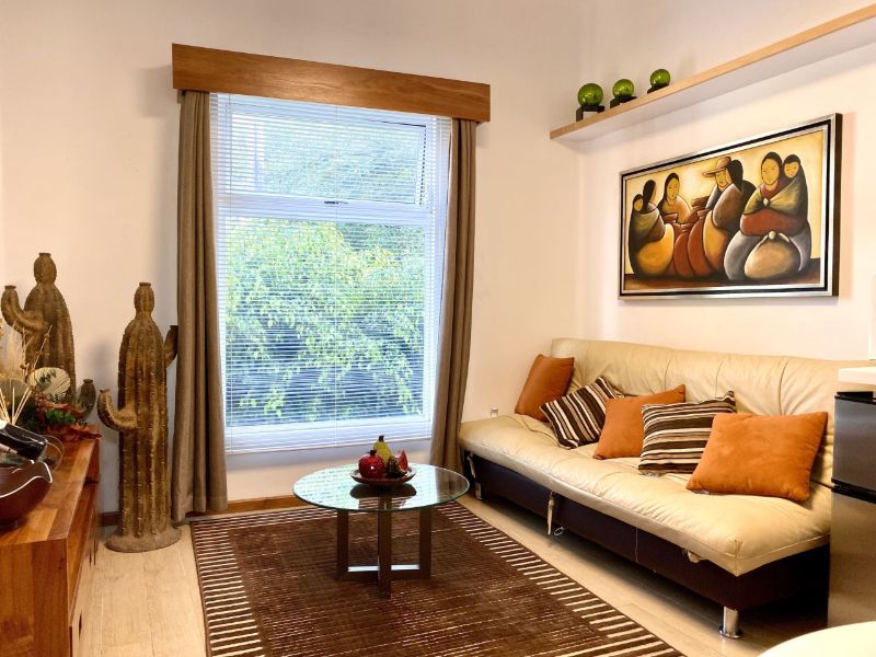 Living room with Mexican art at Diego Loft Airbnb near historic Coyoacán, Mexico City