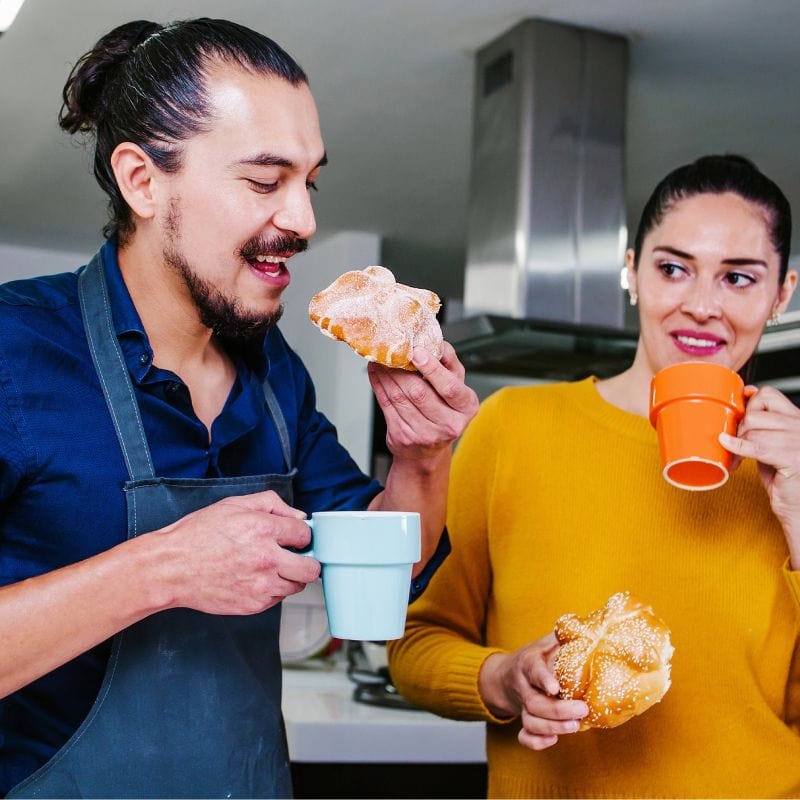 mexicans eating pan de muerto