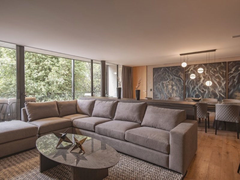 Spacious living room with a sectional sofa at the luxury Airbnb in Polanco, Mexico City