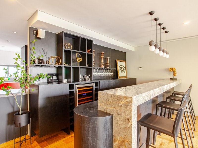 Modern kitchen and breakfast bar at the Incredible Lux Apartment Airbnb in Polanco, Mexico City
