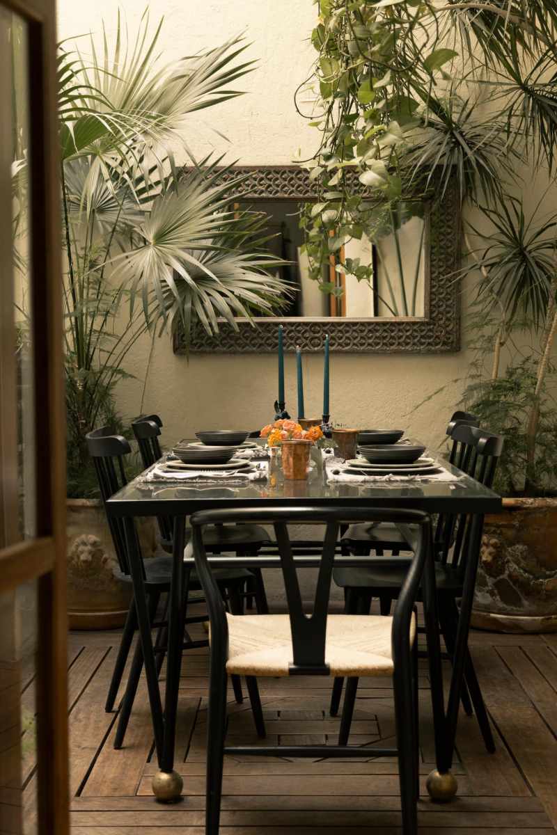Plant-filled dining room at the vintage 1900s home Airbnb in Roma Norte, Mexico City