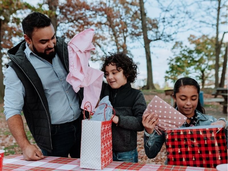 mexican kids opening gifts on three kings day