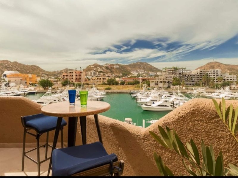 Rooftop seating overlooking the yachts at the Top-Floor Marina Studio with a Private Rooftop Pool in Cabo Marina