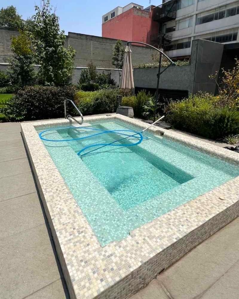 Building pool at the modern apartment Airbnb with a pool, gym and parking in Polanco, Mexico City