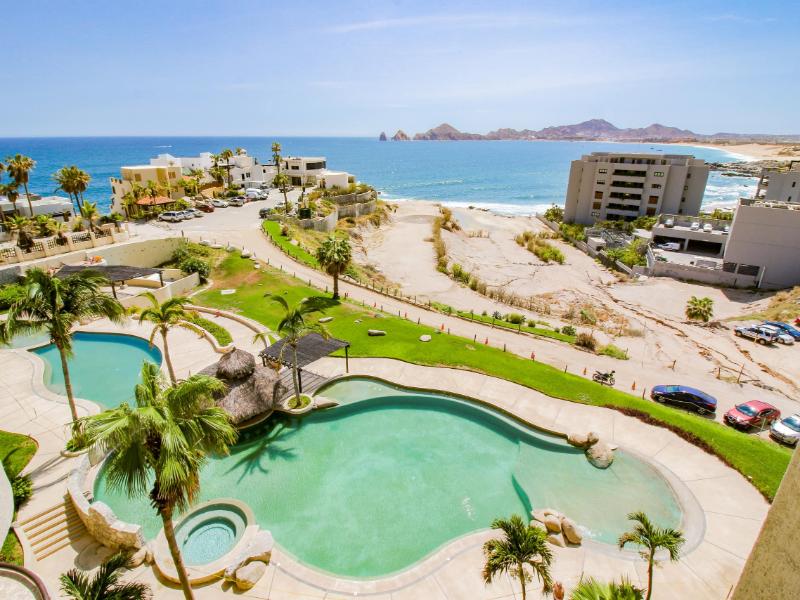 View over the infinity pool and beach from the Ocean-View Condo with a Beachfront Infinity Pool in Cabo Bello, Cabo San Lucas