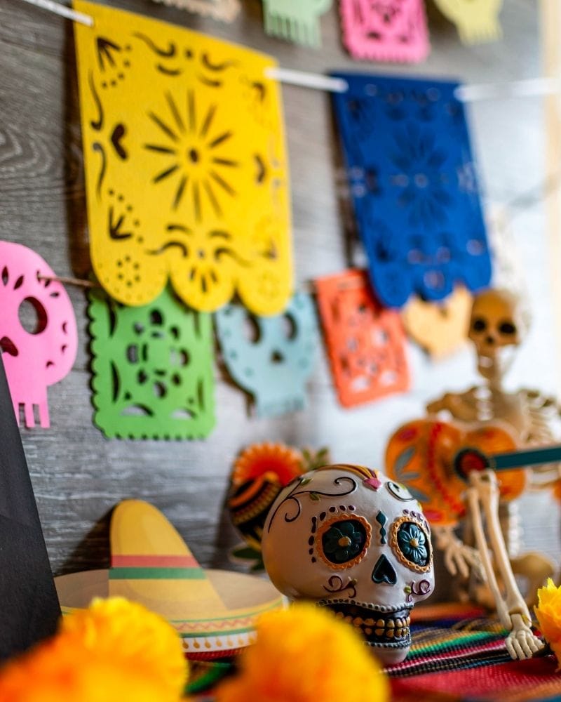 colorful papel papel mexican paper on a day of the dead altar (ofrenda)
