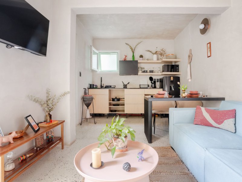 Living room and kitchen at the quiet 1-bedroom Coyoacán Airbnb across from the market, Mexico City