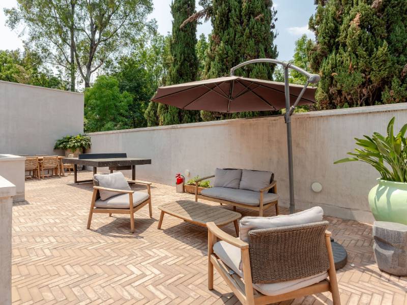 Shared patio with lounge chairs at the quiet 1-bedroom Airbnb by the Coyoacán market