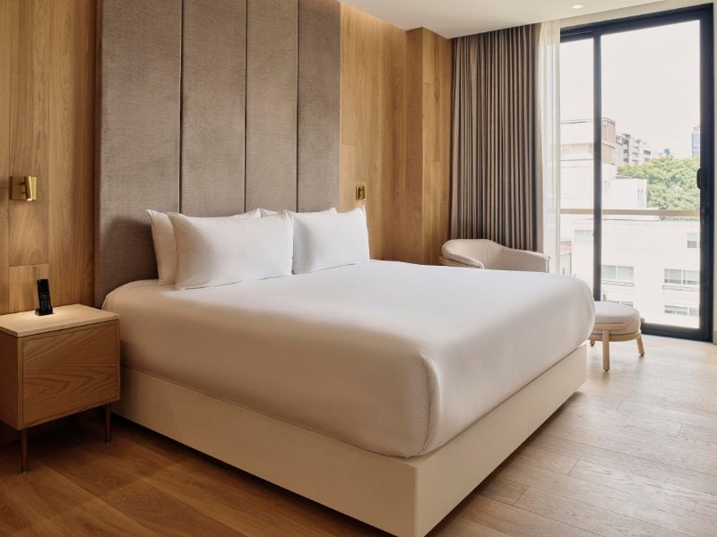 White king bed and balcony doors at the Quiet, Private Balcony Residence in Polanco, Mexico City