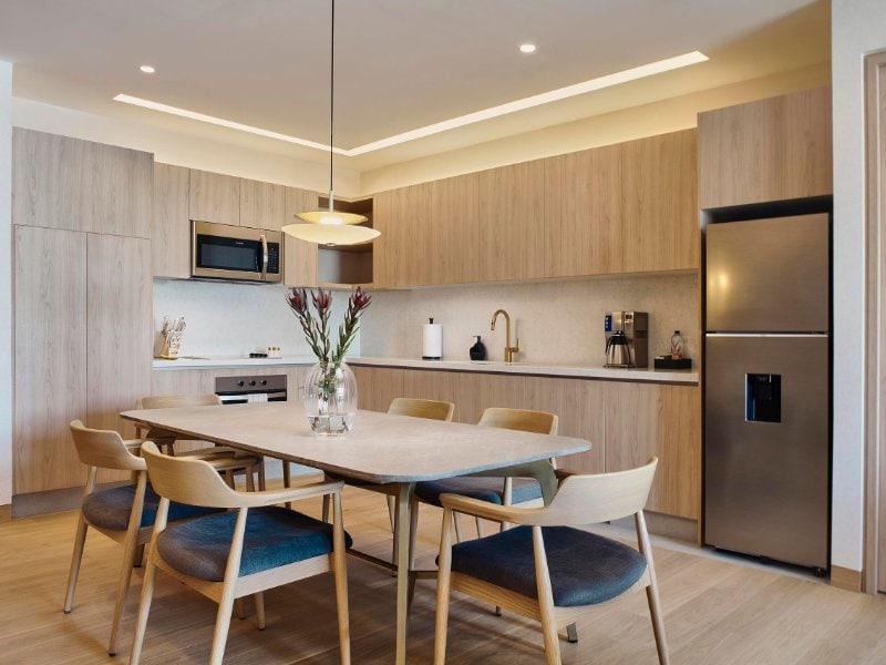 Modern kitchen and dining table at the Quiet, Private Balcony Residence in Polanco, a Mexico City luxury rental
