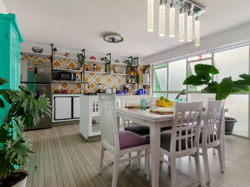 Open kitchen and dining area at the stylish 2-bedroom apartment Airbnb in Coyoacán, Mexico City