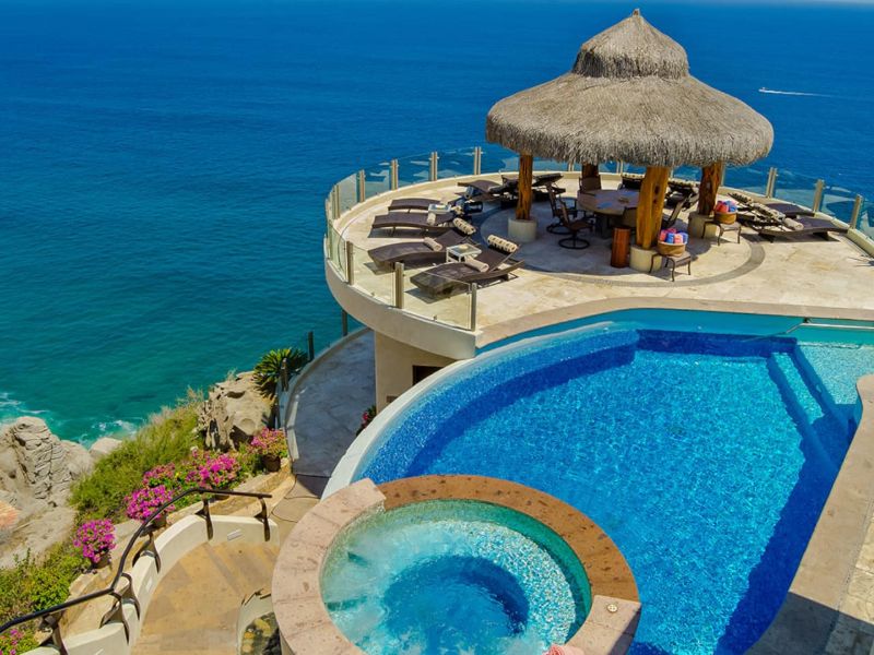 Infinity pool, hot tub and palapa deck above the ocean at Villa Penasco in Pedregal, Cabo San Lucas