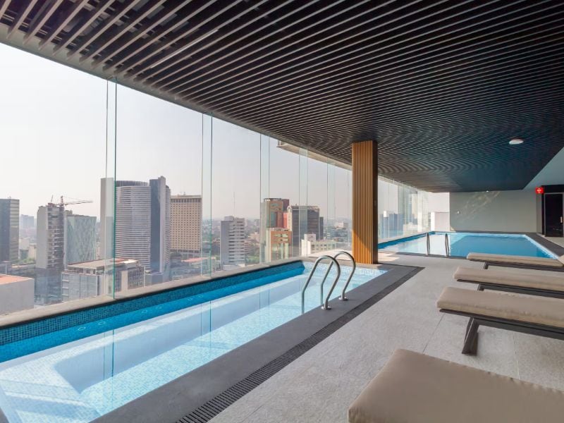 Indoor pool with skyline views at Zero-Zero-Seven-HOME, a Mexico City Airbnb in San Rafael